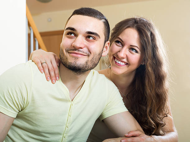 istock Adult couple on sofa in home 474298510
