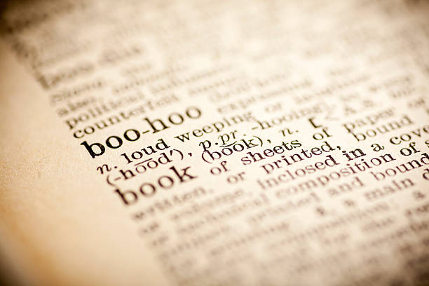 istock Old dictionary open on the word boohoo 474299450