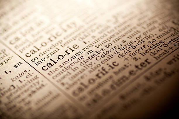 istock Old dictionary open on the word calorie 474299466