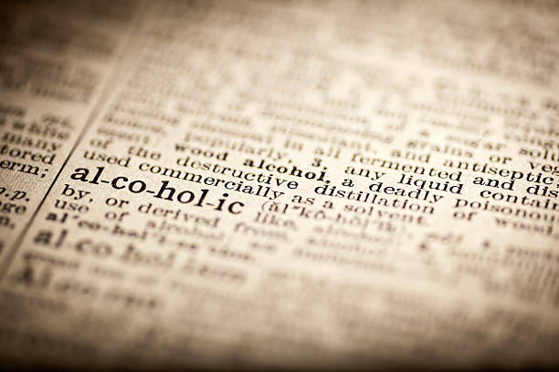 istock Old dictionary open on the word alcoholic 474299522