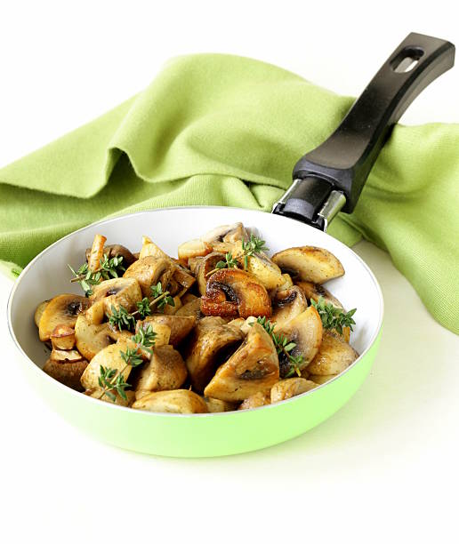 istock fried champignon mushrooms with thyme in a pan 474300779