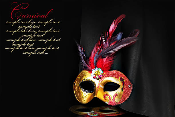 istock Carnival mask on black silk background 474303289