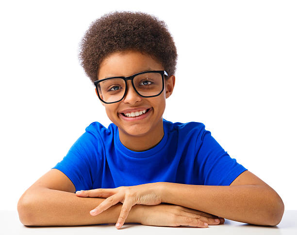 Happy African American school boy Portrait of smiling, handsom African American school boy, teenager. Studio shot, over white background, with copy space. nerd teenager stock pictures, royalty-free photos & images