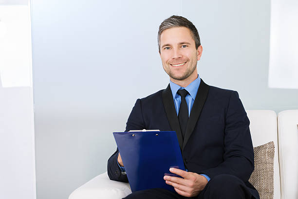istock Businessman Holding Clipboard 474305388