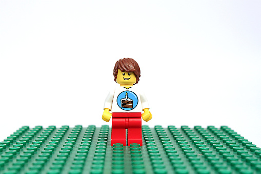Colorado, USA - May 18, 2015: Studio shot of Lego birthday boy minifigure. Legos are a popular line of plastic construction toys manufactured by The Lego Group, a company based in Denmark.