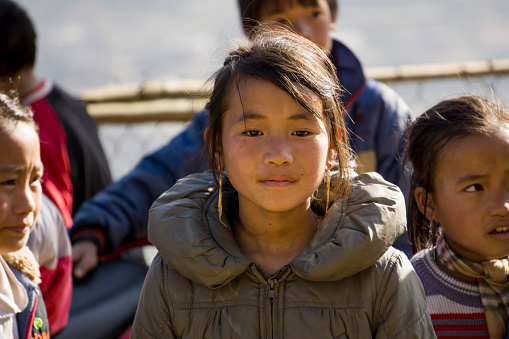 Sapa, Vietnam- January 22, 2015: A portrait of a local Vietnamese Hmong girl in the mountain region of Sapa. The Hmong are a ethnic tribal group that live in the mountainous areas of Vietnam, China, Laos and Thailand