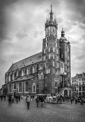 Cracow ( Krakow ), Poland - May 01, 2015: black and white photo of Mariacki church at the Main Square in Cracow ( Krakow ), Poland