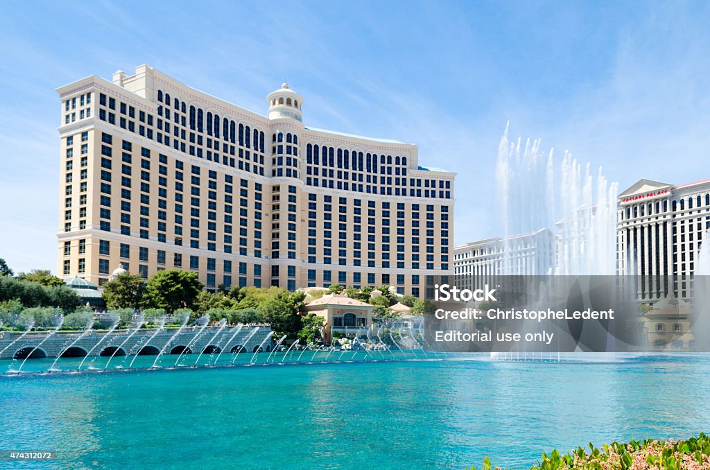 Fountains of the Bellagio Hotel, Las Vegas Las Vegas, Nevada - April 11, 2015: The famous fountains in action at the Bellagio Resort and Casino in Las Vegas, Nevada on a mildly cloudy. These large dancing water fountains are synchronized to music and play on the half hour both during the day and at night.  Bellagio Hotel Stock Photo