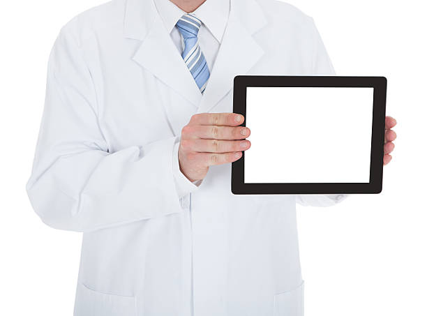 istock Midsection Of Doctor Displaying Digital Tablet 474313260