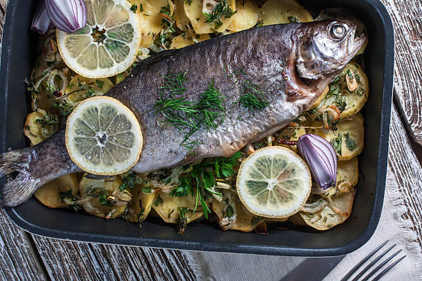 istock Baked trout with potatoes. 474316716
