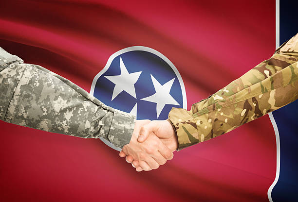 istock Military handshake and US state flag - Tennessee 474317290