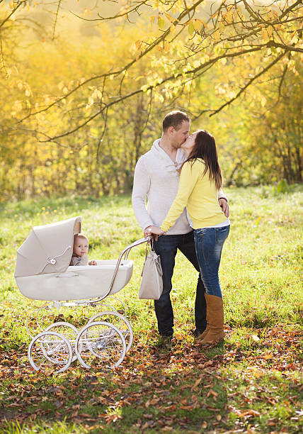 istock Family with vintage pram relaxing in nature 474317765