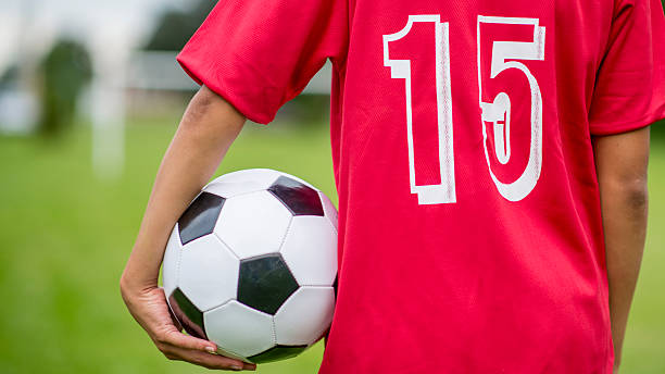 istock Boy Holding Soccer Ball 474320826