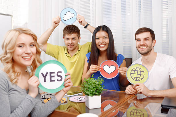 istock Blond girl and her team of developers 474321150