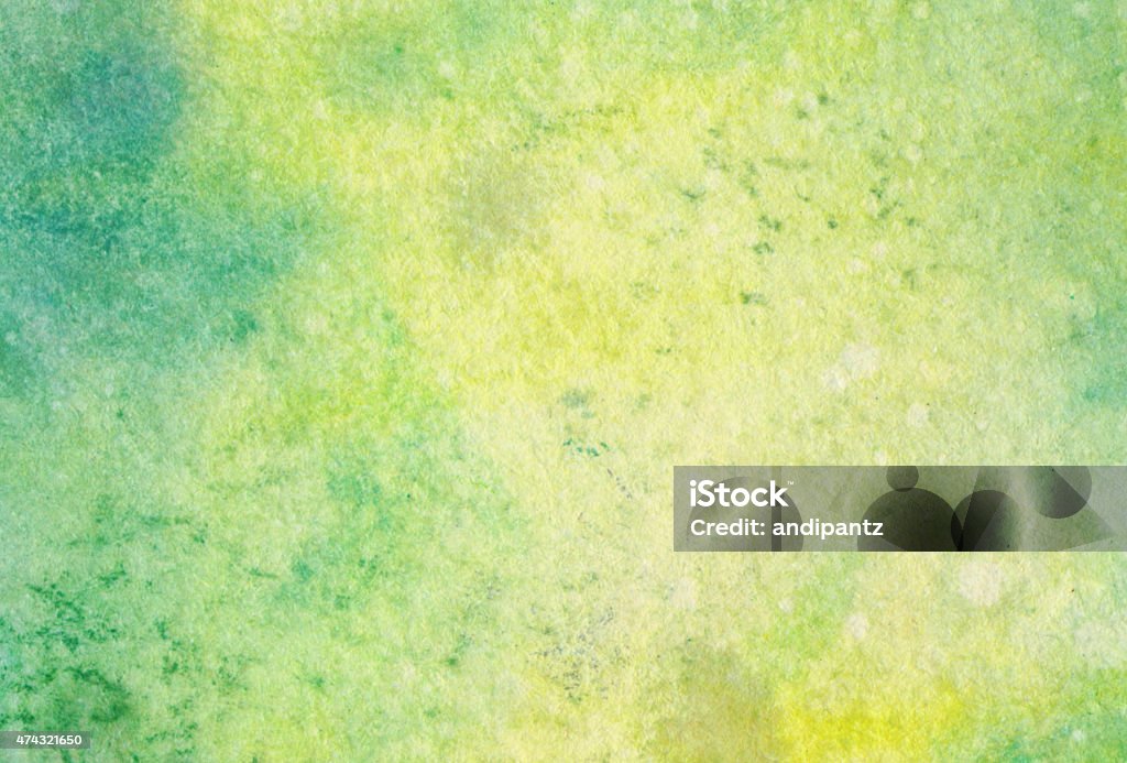 Pastel hand painted background with greens and yellow Hand painted abstract ink background with vibrant shades of blue, yellow and green. It has a mottled texture that would be great for a distressed look in a background design. 2015 Stock Photo