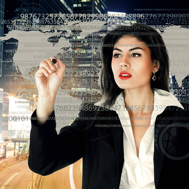 istock Young businesswoman working on touch screen 474322024