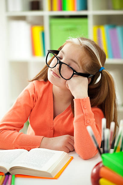 istock Cute little girl is sleeping while wearing glasses 474322707