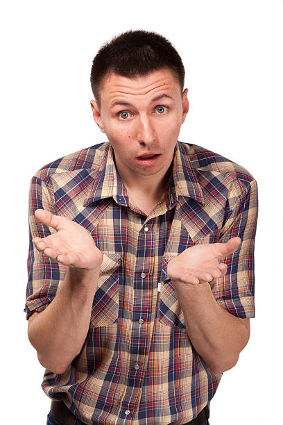 istock Bewildered man in plaid shirt 474324075