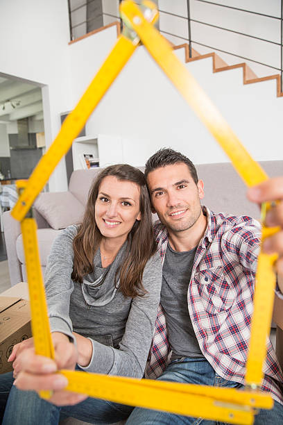 istock young adults moving in new home 474324590