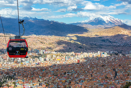 La Paz, Bolivia - August 10, 2014: Cable cars carry passengers between the cities of El Alto and La Paz in Bolivia on August 10, 2014
