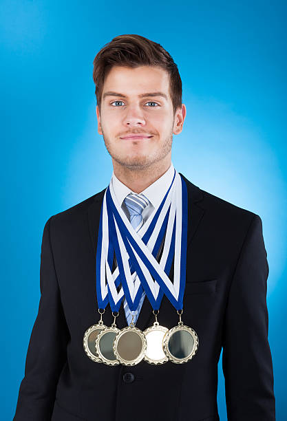 istock Confident Businessman Wearing Medals 474326170