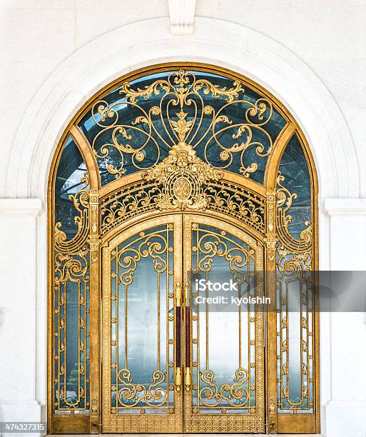 Closed Door Of Building With Gold Ornate Pattern Stock Photo - Download Image Now - Gold Colored, Door, Carving - Craft Product