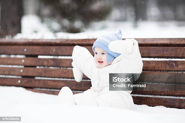 Cute Funny Baby Sitting On Bench In Park Stock Photo - Download Image Now - Baby - Human Age, Baby Girls, Backgrounds