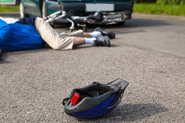 istock Unconscious Cyclist after a road accident 474328908