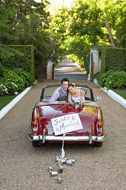 istock Newlywed Couple In Retro Wedding Car 474333517