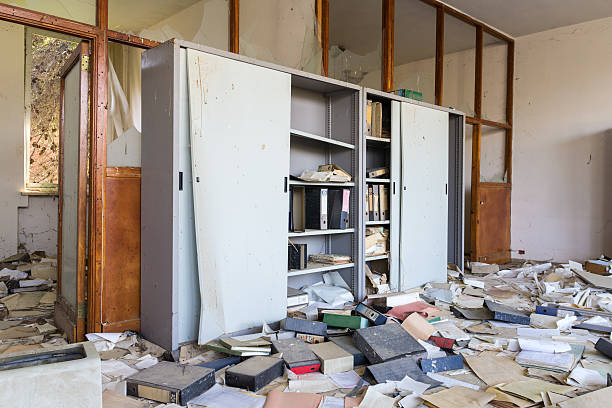istock Abandoned office with many papers on the floor 474335012