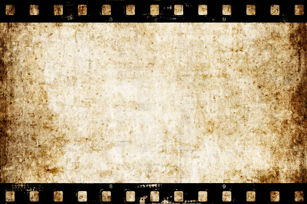 istock Aged paper background with film strip 474335186