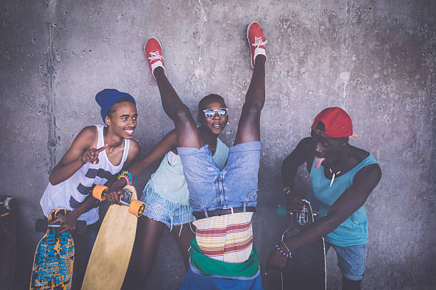 istock Happy friends with longboards having fun with crazy poses 474339624