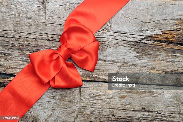 Red Bow With Copy Space On Old Wood Stock Photo - Download Image Now - Abstract, Beauty, Celebration