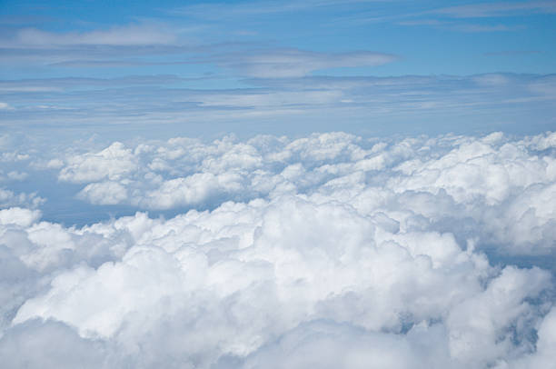 istock View at earth from airplane window above the clouds 474347790