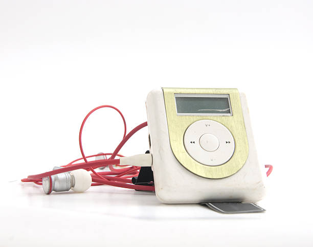 istock Green Metallic MP3 player and red earpiece 474348658