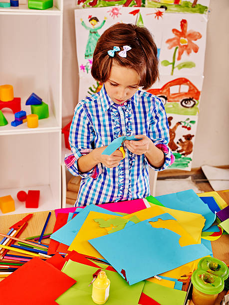 istock Child with  scissor at school 474349342