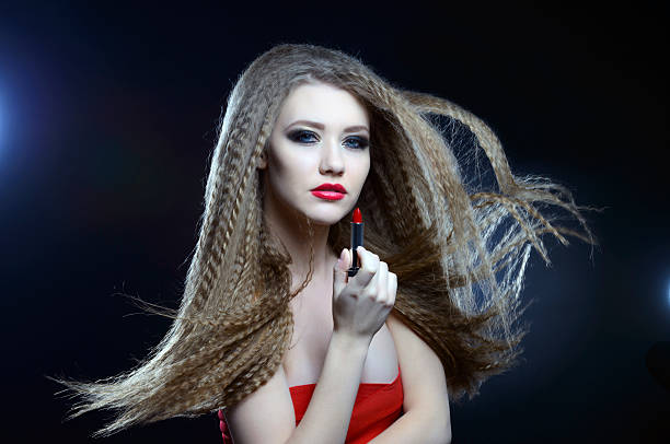 istock woman with lipstick 474352729