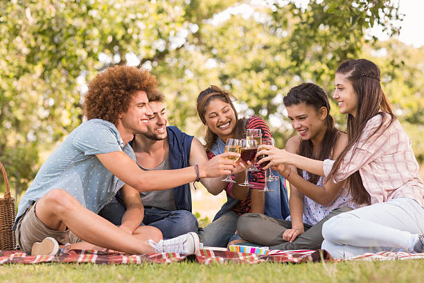 istock Happy friends in the park having picnic 474354586