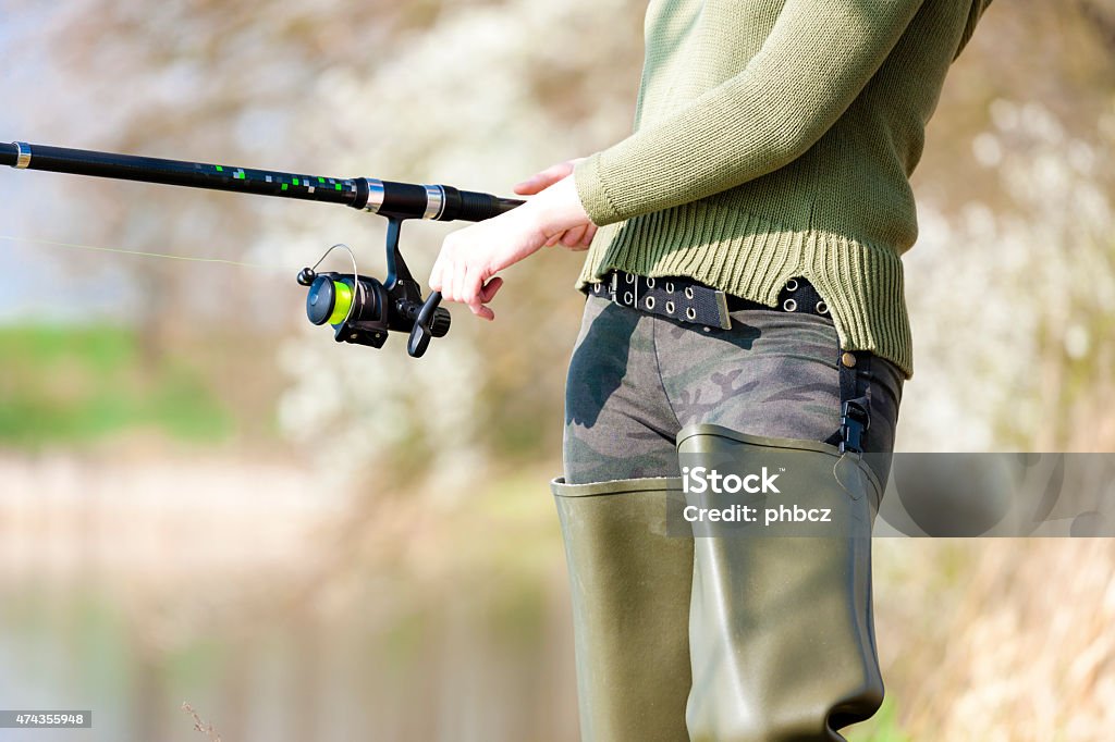 detail of fishing woman detail of fishing womandetail of fishing womandetail of fishing woman with fishing rod 2015 Stock Photo