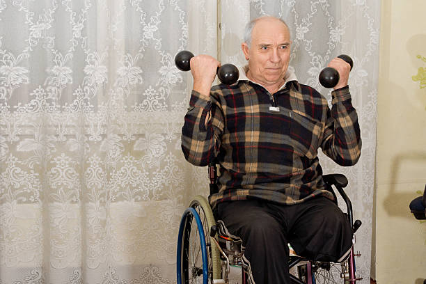 istock Handicapped senior man working out 474355998