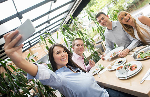 istock People taking a selfie at a restaurant 474356474