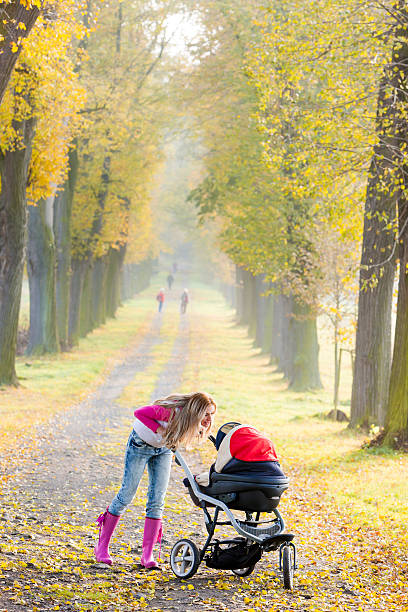 istock woman with a pram 474357298