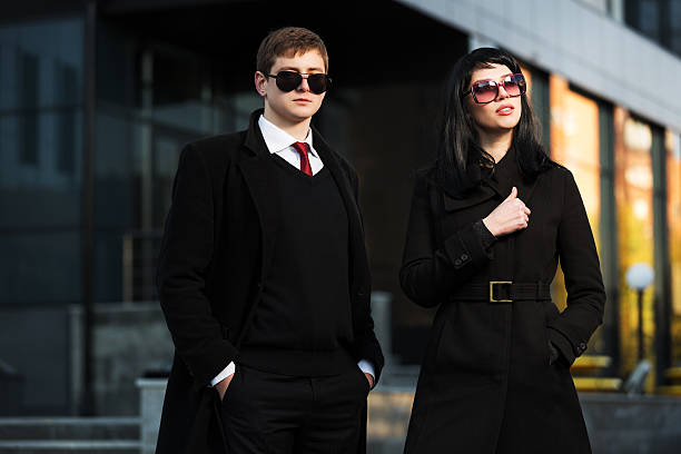 istock Young business couple against office building 474357547