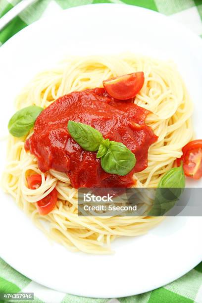 Spaghetti With Tomatoes And Basil On Plate Stock Photo - Download Image Now - 2015, Basil, Bolognese Sauce