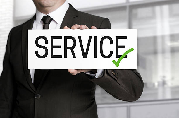 istock Businessman holding sign service to viewer 474359970