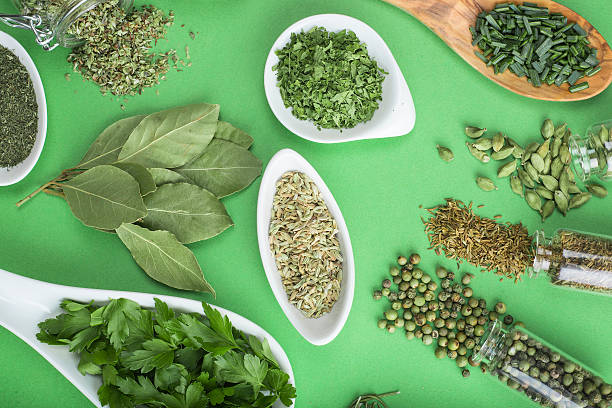 istock Green spices on a green background 474359992