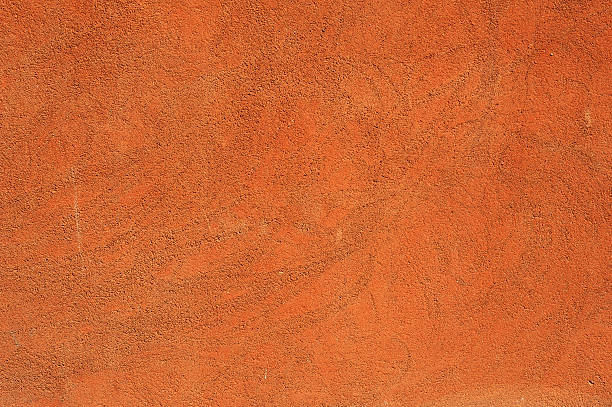 istock Texture of old wall covered with brown stucco 474360016
