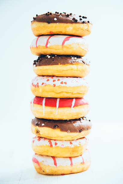 Donuts Stacked On A White Table