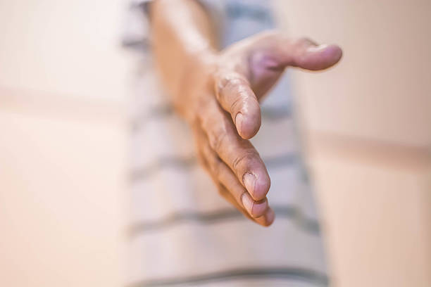 istock hand extending to give help, shallow depth of field 474362754