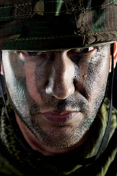 istock Serious soldier portrait 474364323